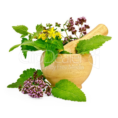Herbs in a mortar and on the table