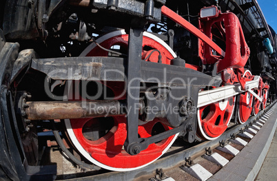 Old steam locomotive wheel and rods details