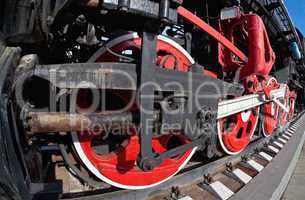 Old steam locomotive wheel and rods details