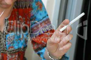 Woman hand with cigarette