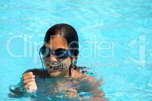 Teen girl in swimming pool portrait
