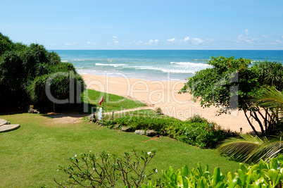 Beach and turquoise water of Indian Ocean, Bentota, Sri Lanka