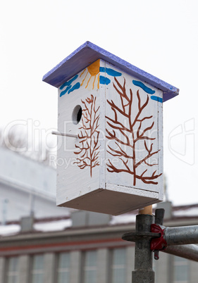 Nesting box against cloudy sky background