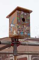 Nesting box against cloudy sky background