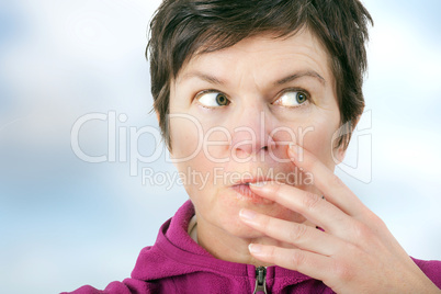 Woman eating cookie