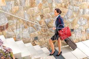 Smiling woman business going traveling baggage leaving