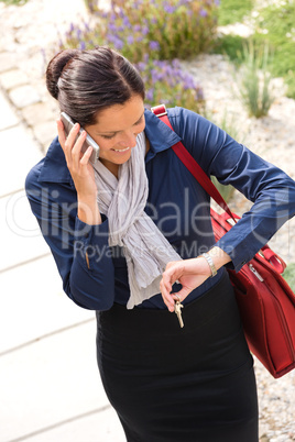 Woman calling rushing arriving home business phone