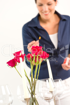 Young woman lighting candle lunch romantic love