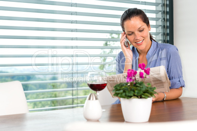 Smiling woman talking mobile phone relaxing reading