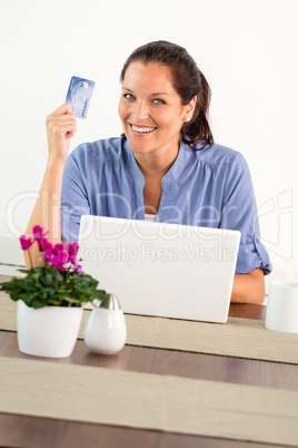 Smiling woman shopping online home credit card