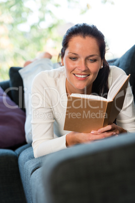 Female student studying couch home bookworm woman