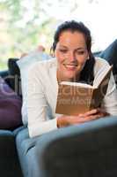 Female student studying couch home bookworm woman
