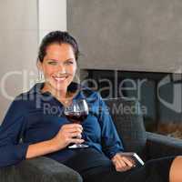 Young businesswoman resting work mobile phone wine
