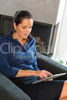 Young businesswoman using digital tablet