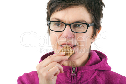 Woman eating biscuit