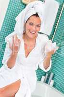 Happy woman enjoying spa treatment hotel bathroom