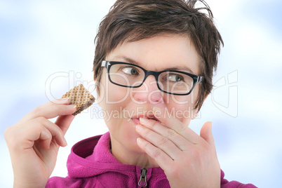 Woman eating cookie