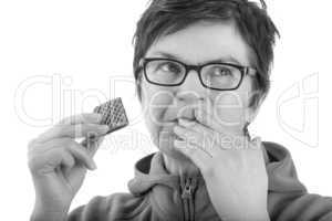 Woman eating biscuit