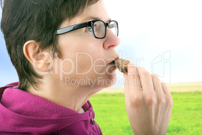 Woman eating cookie