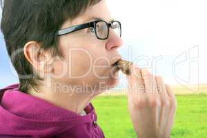 Woman eating cookie