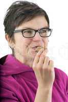 Woman eating biscuit