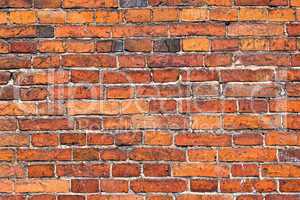 Old weathered red brick wall as background