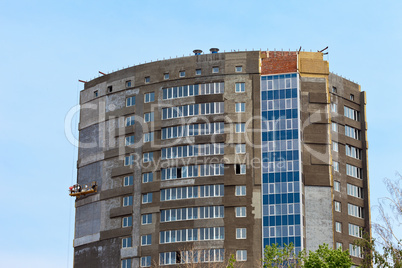 Construction of modern building against blue sky