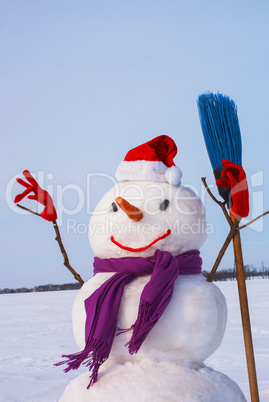 Lonely snowman at a snowy field