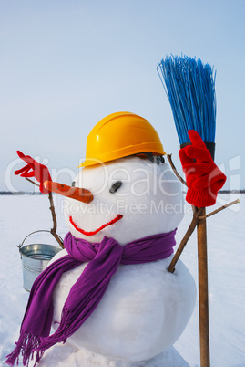 Lonely snowman at a snowy field