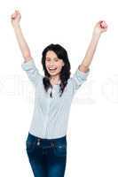 Excited young woman celebrating her success