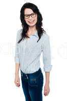 Happy woman in trendy wear. Shirt and jeans
