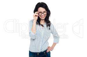 Pretty woman adjusting her spectacles