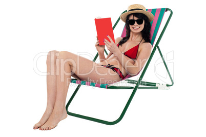 Young woman reading book and relaxing