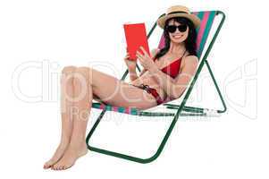 Young woman reading book and relaxing