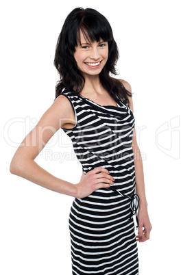 Fashionable young girl in trendy sleeveless attire