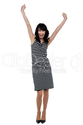Happy woman throwing her hands up in celebration
