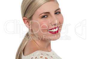 Charming teen model flashing toothy smile