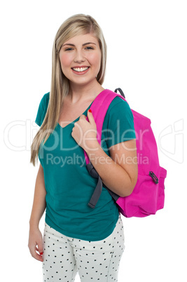 Teen posing with pink backpack