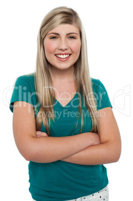 Gorgeous blonde girl posing arms crossed