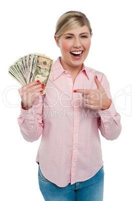 Pretty woman holding up dollar notes