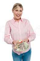 Young woman with dollars in her hands