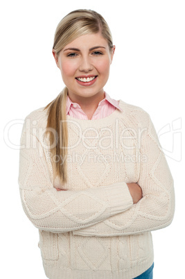 Confident teenage girl posing with folded arms
