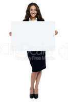 Corporate woman displaying blank whiteboard