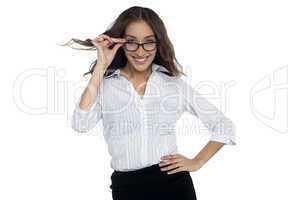 Young businesswoman adjusting her spectacles