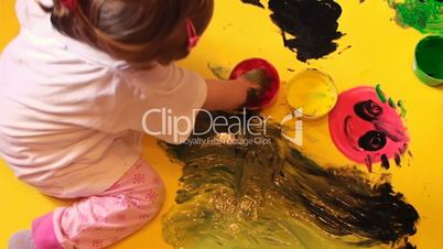 Little Girl Painting With Hands Long