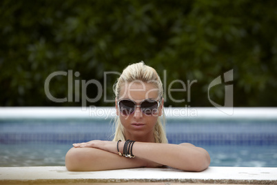 Beautiful Woman in a Swimming Pool During Summer