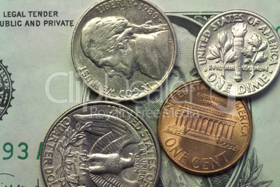 coins over one dollar bill