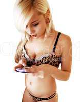 Girl in lingerie texting.