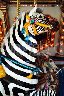 zebra ride on a merry go round