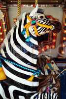 zebra ride on a merry go round